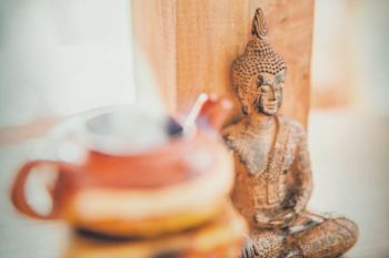 Tea pot and Buddha statue